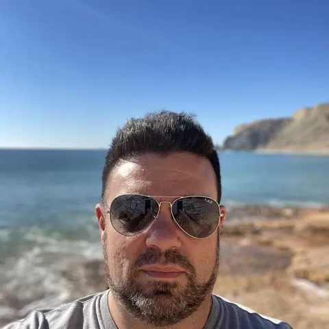 Mark, on the rocks at Praia da Luz